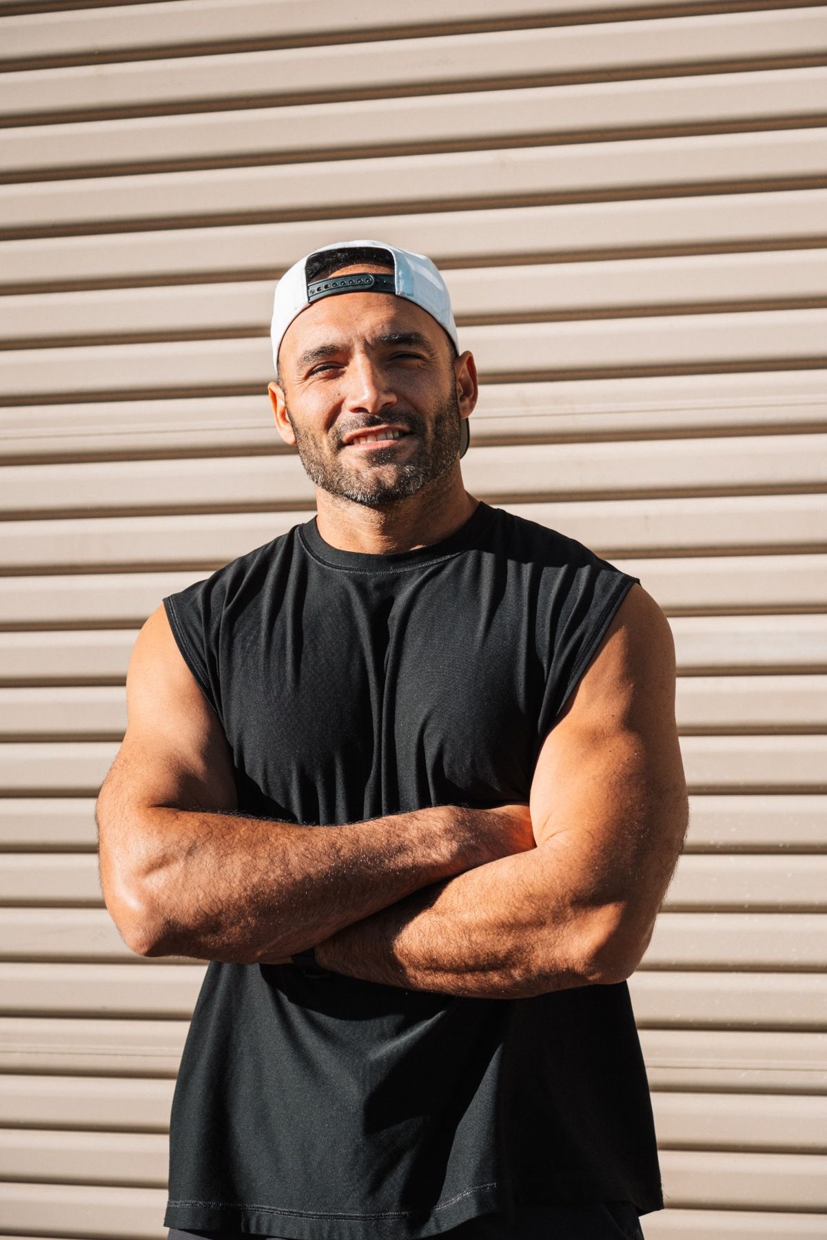 Nick, founder of PowerMove8 Coaching, standing with arms crossed